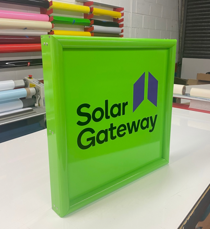 Custom projecting swing sign designed, manufactured and installed by Custom Xpress